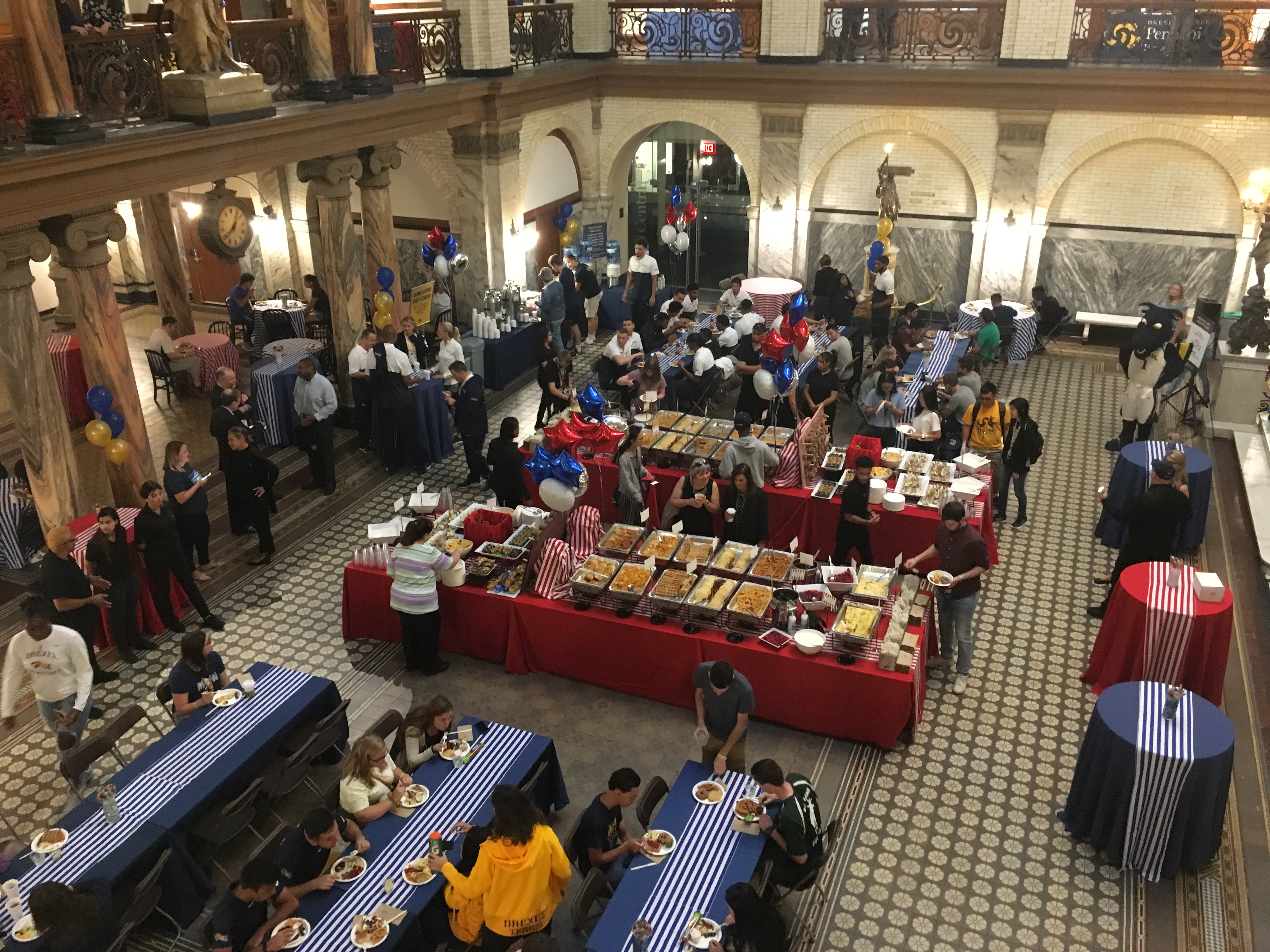 Students eat breakfast at a reception in the Main Building